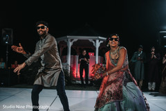 Indian bride and groom's sangeet performance. Indian bride and groom's sangeet performance.