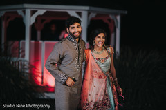 Joyful Indian bride and groom at their sangeet celebration portrait. Joyful Indian bride and groom at their sangeet celebration portrait.