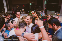 Indian wedding guests surrounding the groom suit,indian wedding