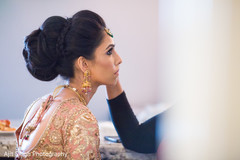 Lovely Indian bride getting her hair and makeup done. Lovely Indian bride getting her hair and makeup done.