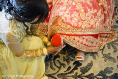 Fabulous Indian bride getting her shoes on capture. Fabulous Indian bride getting her shoes on capture.