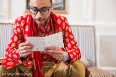 Indian groom reading his vows for the wedding ceremony. Indian groom reading his vows for the wedding ceremony.