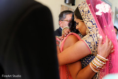 Indian wedding family hugging the bride bridal lengha,indian bride fashion