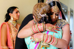 Indian bride hugging her family indian bride jewelry,indian bride bangles,mehndi