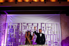 Indian newlyweds toasting indian wedding,indian wedding reception fashion,suit