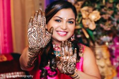 Sweet indian bride showing mehndi art Sweet indian bride showing mehndi art