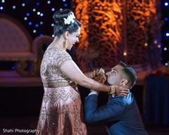 Sweet indian groom kissing bride's hand bridal lengha,indian groom fashion,suit