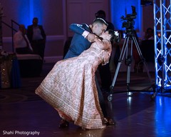 Lovely kiss capture of Indian bride and groom at their first dance. indian wedding fashion,indian bride and groom,indian wedding dance