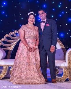 Marvelous Indian lovebirds posing for a portrait. indian bride and groom,indian wedding fashion,indian bride jewelry,indian wedding hair and makeup
