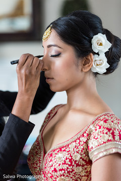 Lovely bride getting her makeup done Lovely bride getting her makeup done