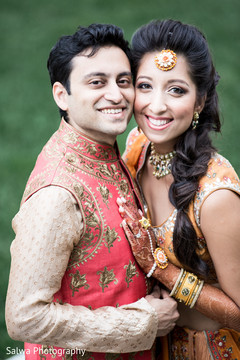 Happy Indian couple looking at camera capture. Happy Indian couple looking at camera capture.