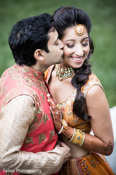 Elegant Indian groom kissing bride photo sessio Elegant Indian groom kissing bride photo sessio