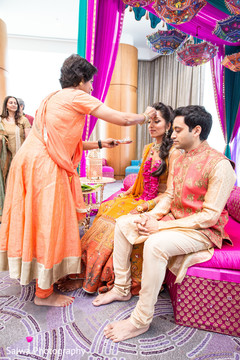 Indian bride and groom getting the red kum-kum mark. Indian bride and groom getting the red kum-kum mark.