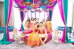 Lovely Indian family portrait taken with bride and groom at the mehndi celebration. Lovely Indian family portrait taken with bride and groom at the mehndi celebration.