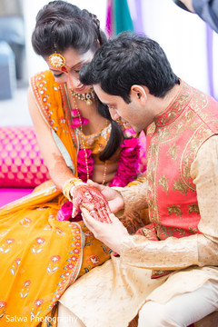 Indian groom amazed by mehndi art. Indian groom amazed by mehndi art.