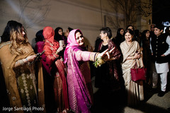 Guests saying good bye to indian newlyweds Guests saying good bye to indian newlyweds