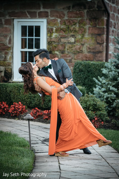 Adorable Indian bride being kissed by groom. indian wedding fashion,indian bride and groom,indian wedding hair and makeup