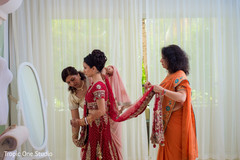 See the Final touch ups for this charming indian bride. indian wedding gallery,indian bride getting ready,indian bride fashion,bridal jewelry