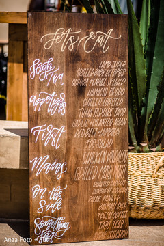 Wooden Indian wedding food menu sign. Wooden Indian wedding food menu sign.