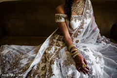 Indian bride posing with her Indian wedding ceremony dress.