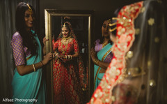 See the Final touch ups for this charming indian bride. indian wedding gallery,indian bride getting ready,bridal jewelry,indian bride fashion