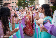 Indian newlyweds leaving wedding ceremony indian wedding ceremony,indian wedding ceremony photography,indian bride and groom