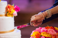 India bride and groom cutting wedding cake's capture. India bride and groom cutting wedding cake's capture.