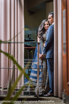Gorgeous Indian bride and groom looking at camera. indian wedding reception fashion,indian bride and groom,indian bride hair and makeup