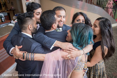 Indian bride and groom getting hugs from friends tender moment. Indian bride and groom getting hugs from friends tender moment.