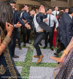 Joyful Indian wedding guest dancing at reception party. indian wedding dance,indian wedding reception fashion,indian wedding mehndi