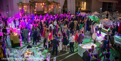 Indian wedding guests celebrating at reception. indian wedding reception fashion,indian wedding dance,indian wedding lights and decor