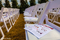 Perfect Indian wedding ceremony guide handouts and seats set up.