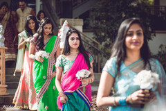 Beautiful indian bridesmaids making their entrance to wedding ceremony Beautiful indian bridesmaids making their entrance to wedding ceremony