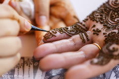 Mehndi artist at work Mehndi artist at work