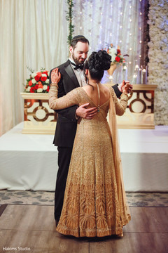 Lovely indian couple having their first dance indian wedding,bridal lengha,indian couple