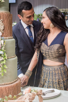 Sweet Indian couple cutting their wedding cake. indian wedding cake,indian bride and groom,indian wedding fashion