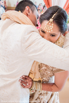 Indian groom putting garland to bride. indian bride and groom,indian bride hair and makeup,indian wedding ceremony