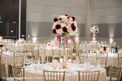 Graceful floral centerpiece and table number. Graceful floral centerpiece and table number.