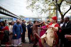 Indian groom dancing during the baraat celebration. indian groom,indian wedding fashion,indian groomsmen,indian groom sherwani