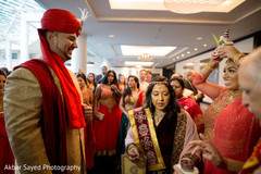 Joyful Indian groom during the Baraat celebration. indian groom,indian wedding fashion,baraat,indian groom sherwani