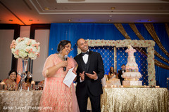 Elegant parents giving a speech at the Indian wedding reception's capture. indian wedding reception,indian wedding fashion
