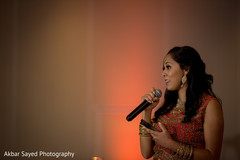 Indian wedding bridesmaid saying some words to bride and groom. indian wedding celebration,indian wedding speech,indian wedding fashion