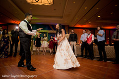 Indian wedding bride and groom having fun at the wedding reception. indian wedding reception,indian wedding fashion,indian wedding bride and groom