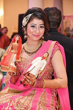 Lovely Indian brides capture posing with Indian wedding dolls. indian bride,indian bride hair and makeup,indian bride jewelry,indian bride fashion