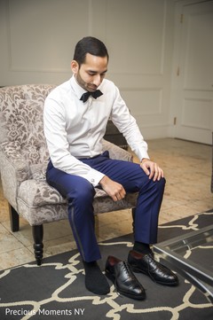 Indian groom putting shoes on indian wedding gallery,indian groom getting ready,indian groom shoes