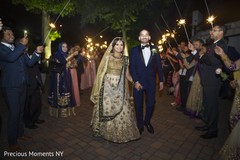 Indian lovebirds leaving wedding venue indian wedding reception,indian wedding reception photography,indian bride and groom