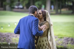 Indian groom kissing the bride to be indian wedding gallery,first look photography,indian bride and groom