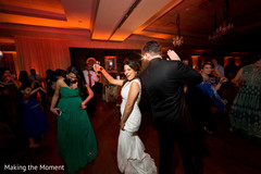 Indian bride and groom dancing the night away indian wedding,white wedding dress,wedding dj
