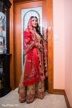 Indian bride glowing in her wedding attire. Indian bride glowing in her wedding attire.