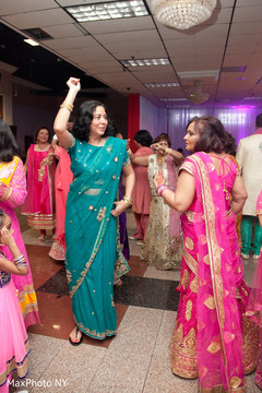 Indian wedding guests dancing during reception Indian wedding guests dancing during reception